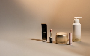 Must-haves for the holiday season next to each other on neutral surface with festive background